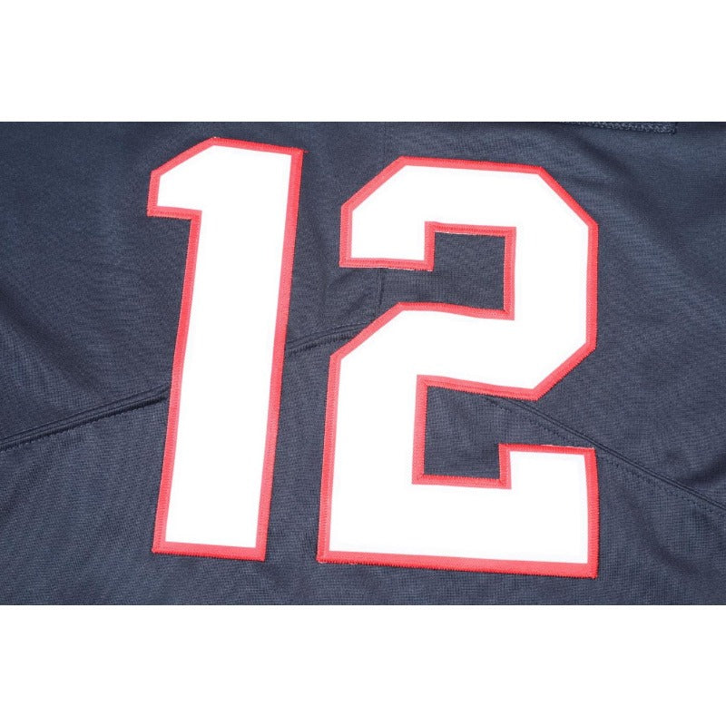 Close-up of the back of a Men's Navy Blue Football jersey showing the number 12 in white with a red outline on a dark navy fabric background.